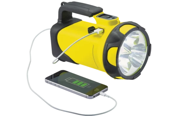 Yellow NightSearcher searchlight connected to a charging device